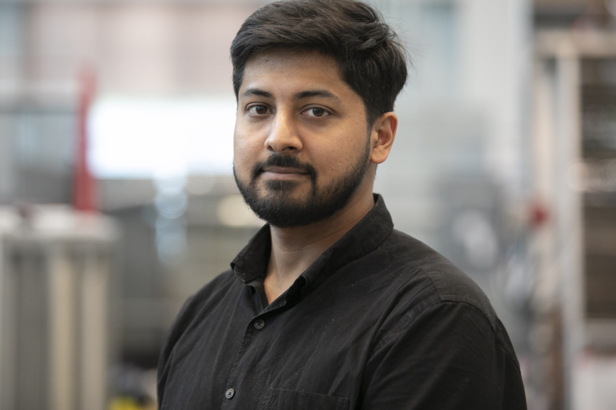 Graduate student standing in lab